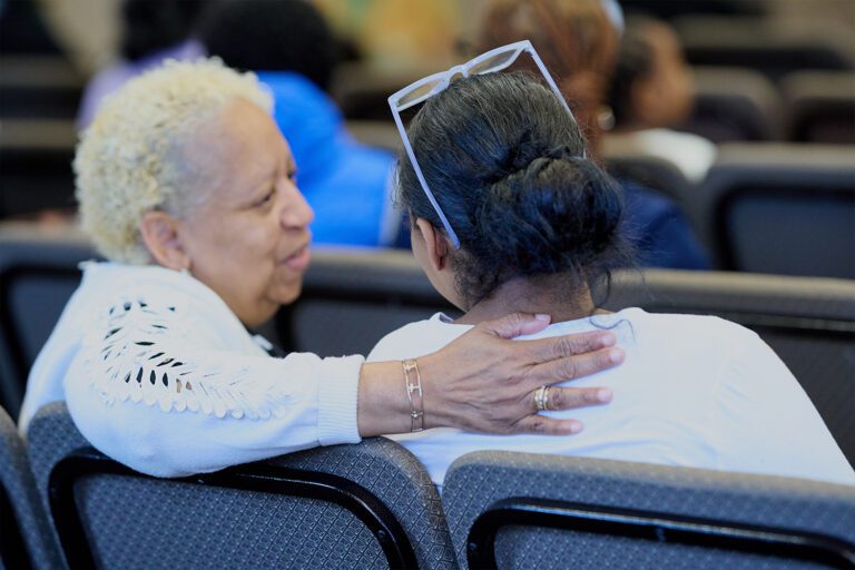 Empowerment Unlimited Church members sitting and talking