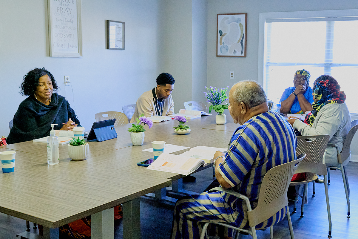 Empowerment Unlimited Church members sitting in a meeting